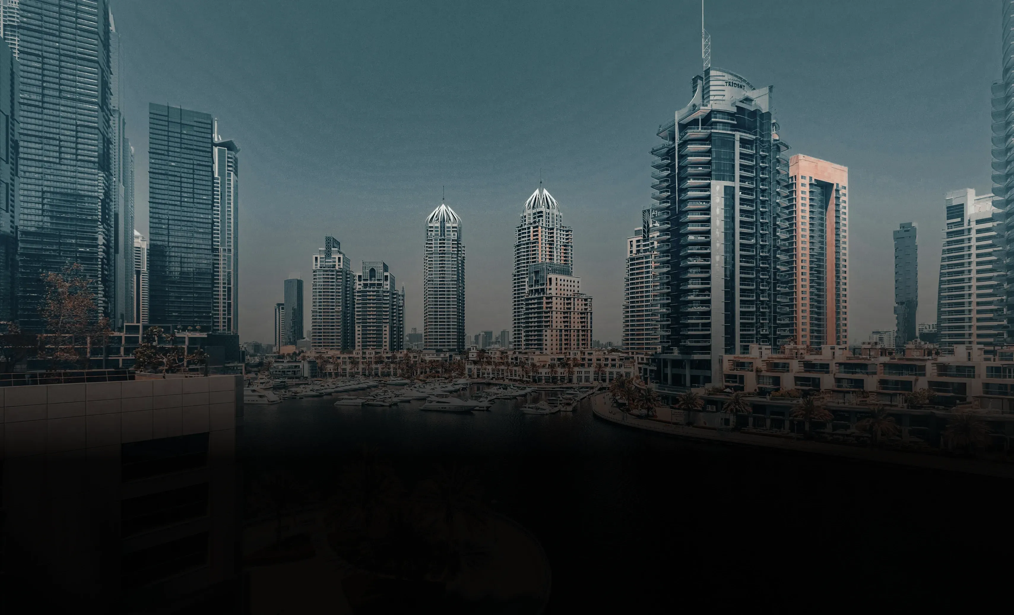 Dubai Marina skyline with waterfront towers at dusk