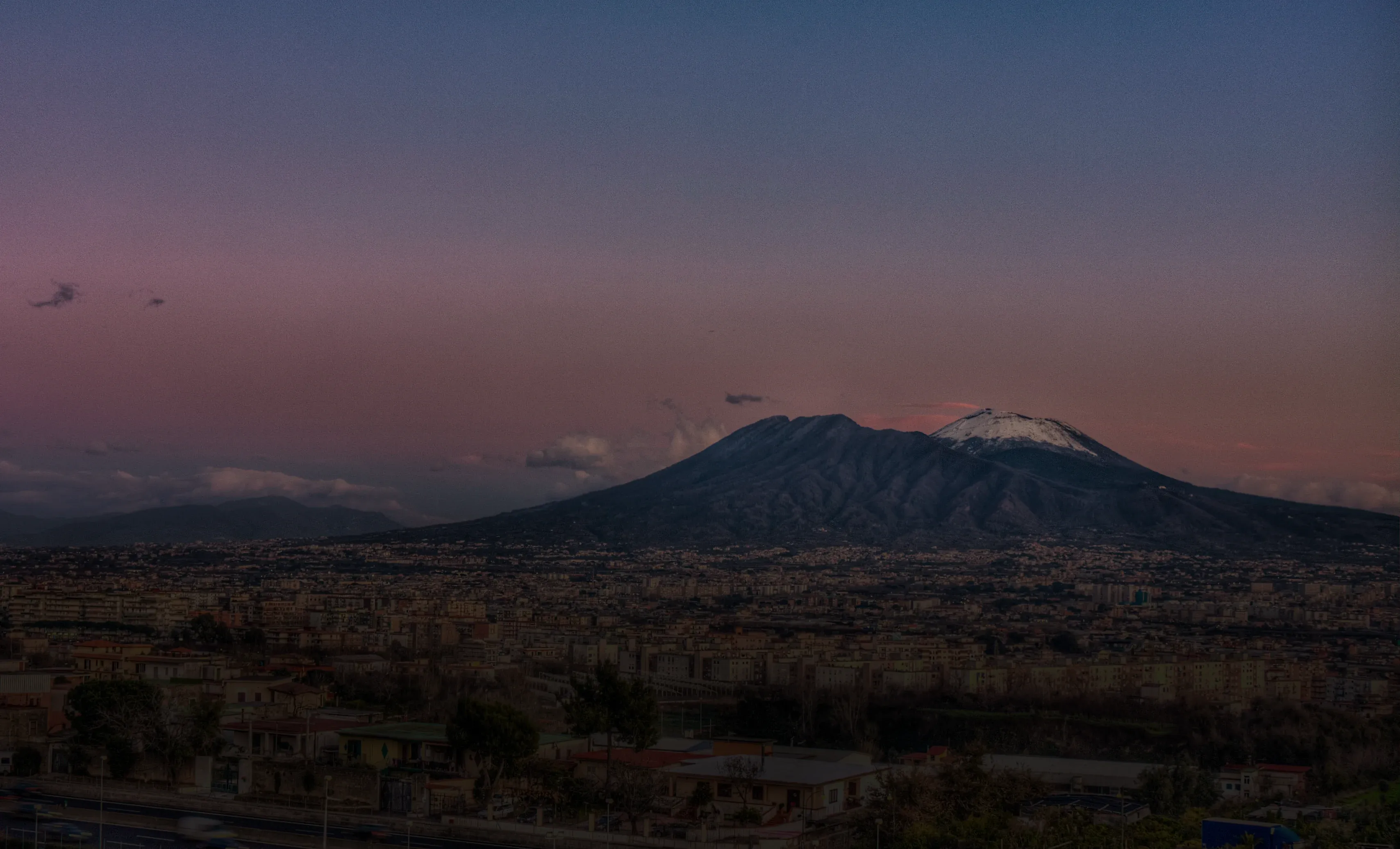 Mount Vesuvius rising over Naples at sunset